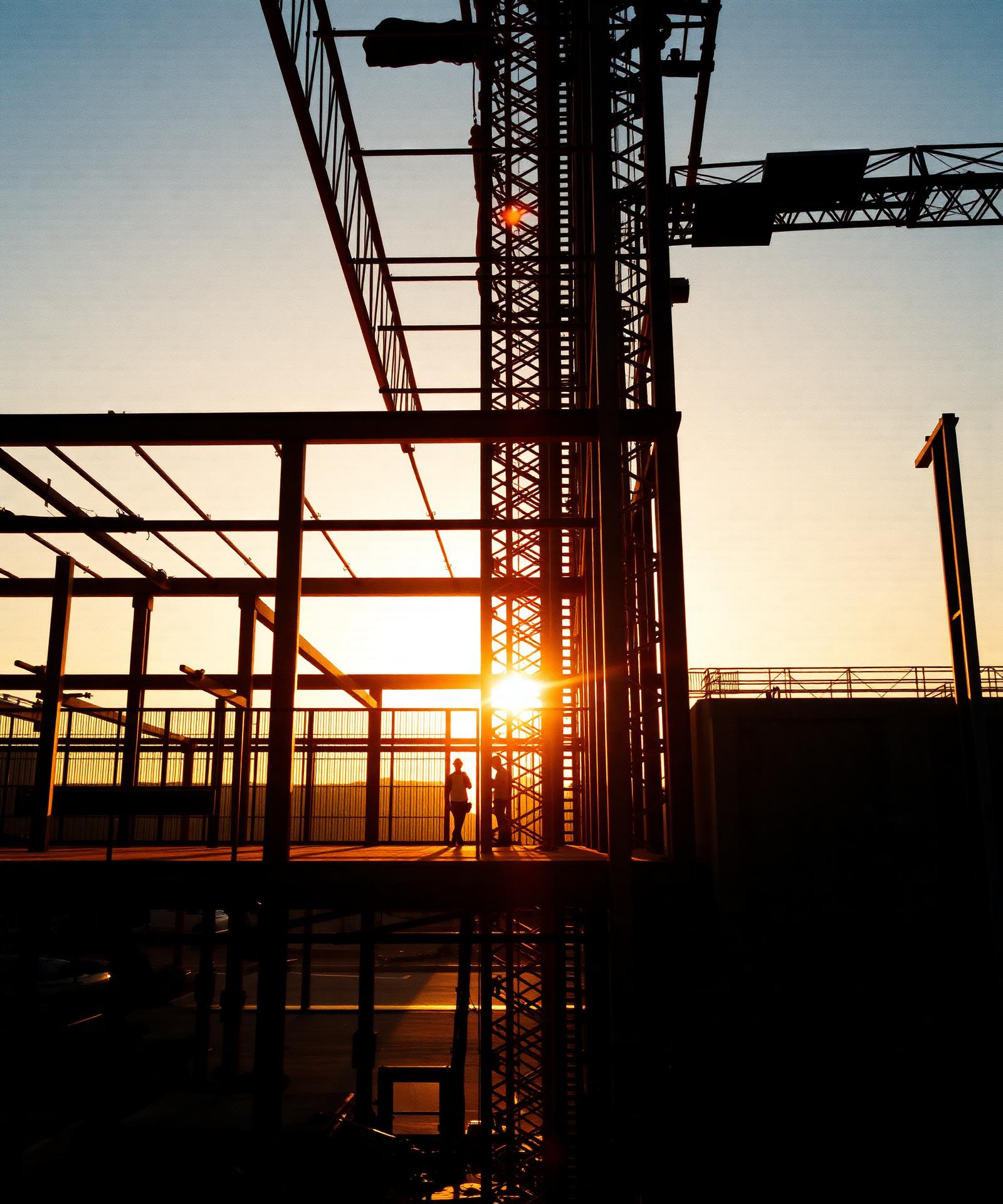 Steel framing of a Gulf Coast construction project at golden hour
